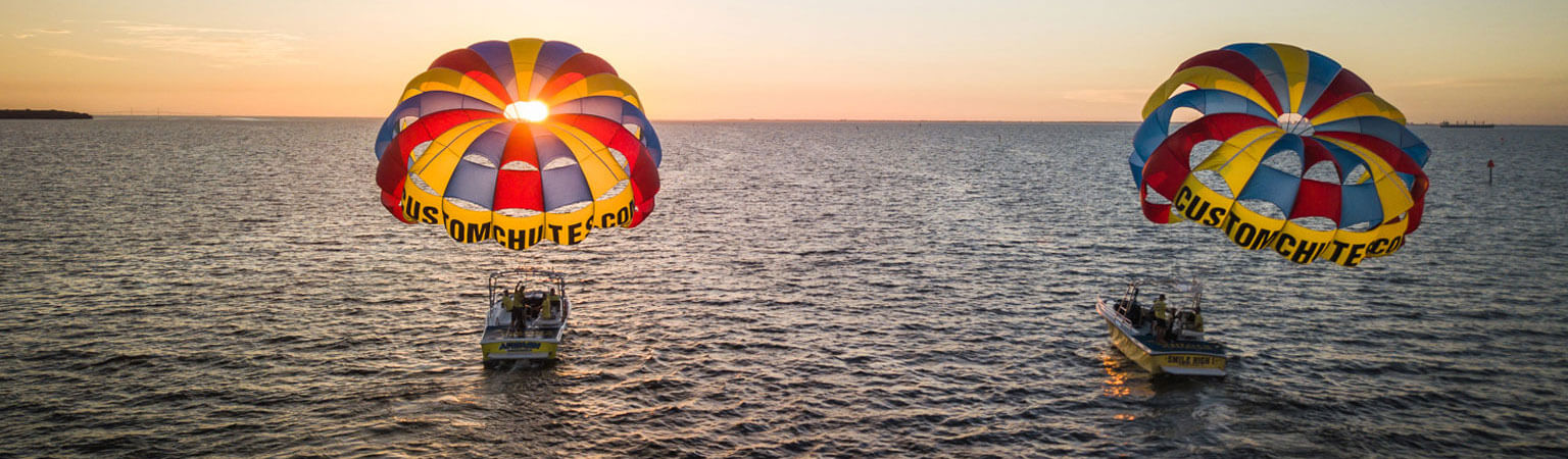 customchutes parasail on boat in sea