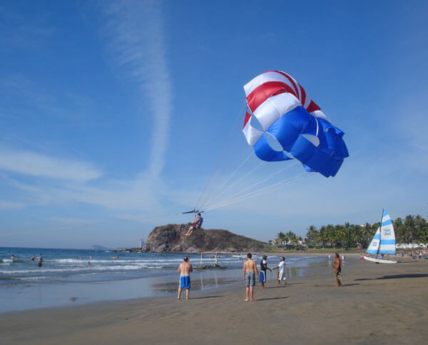 recreational parasails on beach>